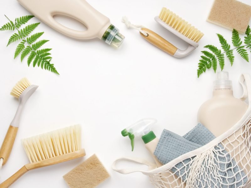 Eco brushes, sponges and rag on white background. Flat lay eco cleaning products. Cleaner concept